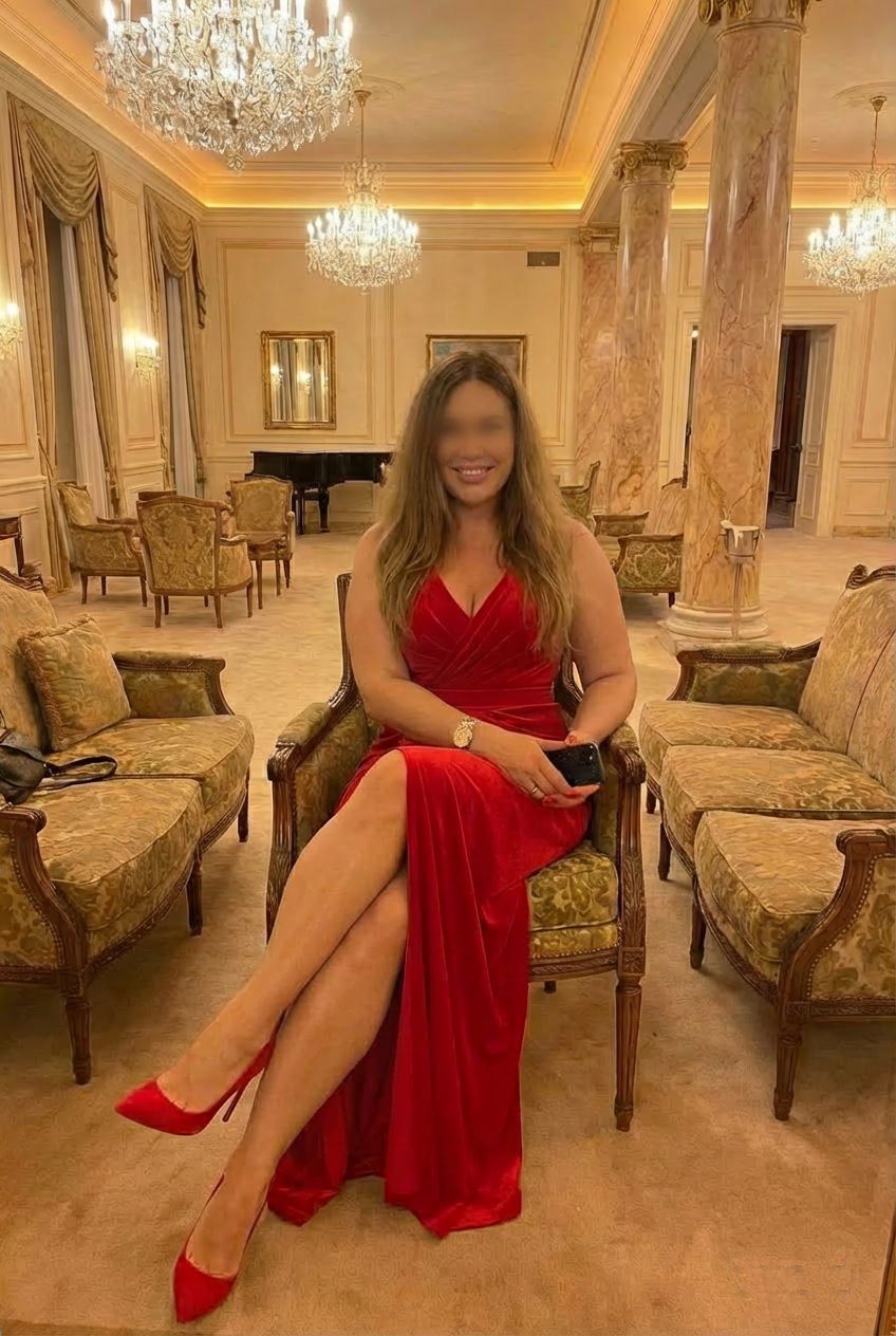 Bbrrolyn busty  British blonde in a red  dress