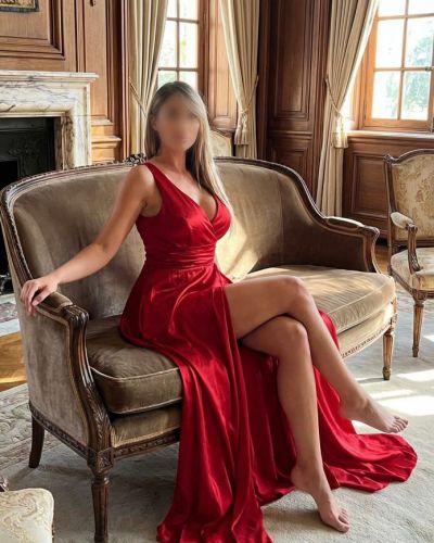 Sabrina busty  blonde posing  in a  red dress