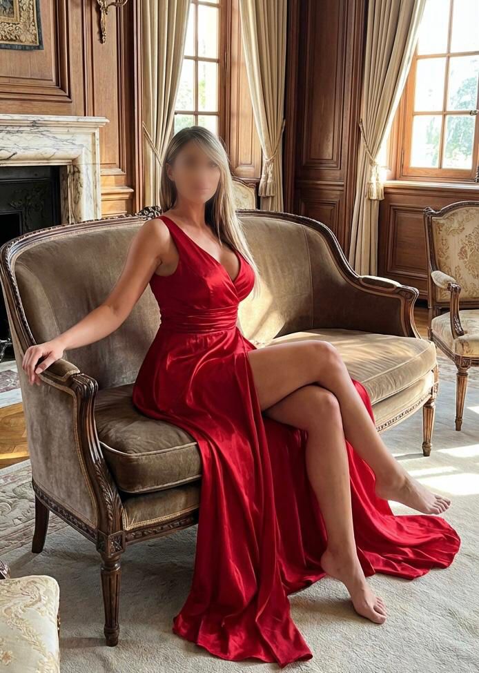 Sabrina busty  blonde posing  in a  red dress